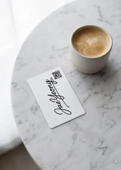 Business_card_on_desk_2K_202608242106